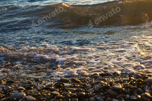 Preview: Sea Pebble Beach With Multicoloured Stones, Transparent Waves With Foam, On A Warm Evening