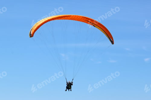 Preview: Tandem Paraglider Flying Orange Wing