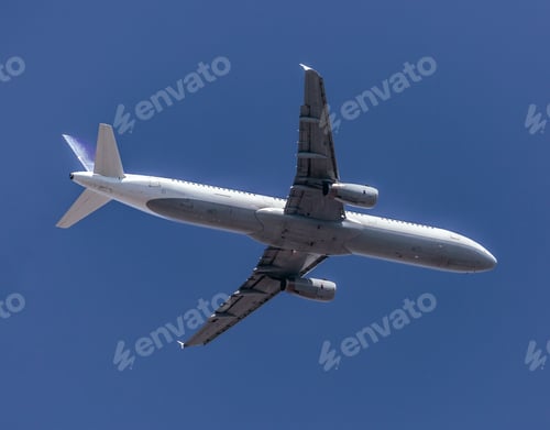 Preview: Jet Airplane Closing In For Landing Against The Blue Sky