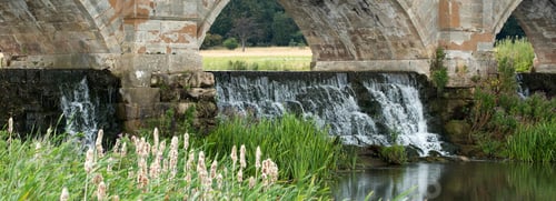 Preview: Water Cascading Under A Stone Bridge