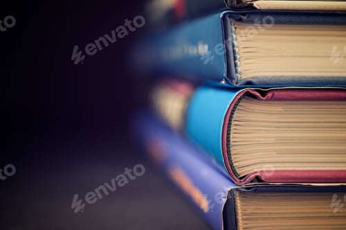 Preview: Books Stacked On A Table.