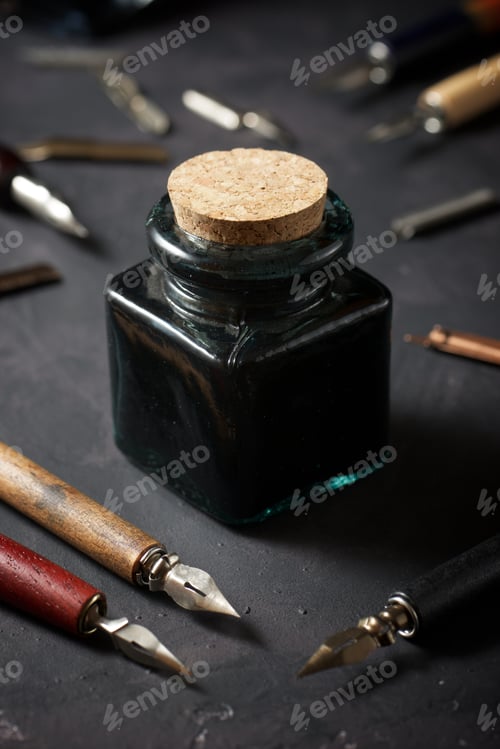 Preview: Nib Pens For Calligraphy And Inkwell On A Table.