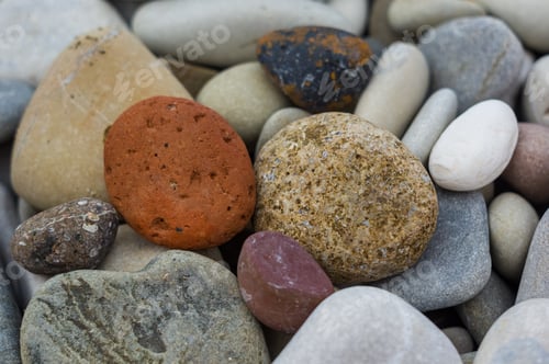 Preview: Boulders And Colorful Pebbles On The Beach