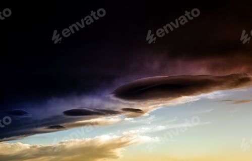 Preview: Abstract Dramatic Clouds Contrast With A Clear Sky