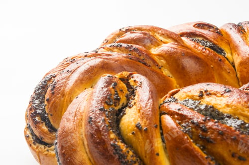 Preview: Braided Poppy Seed Round Loaf On White Background