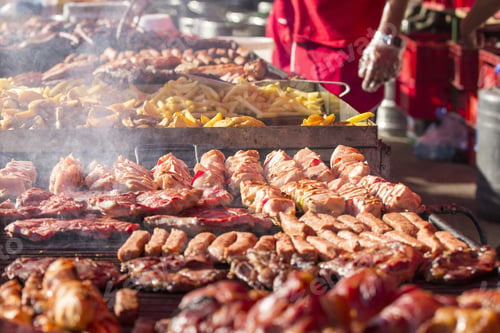 Preview: Different Kind On Grilled Meat And Sausages With Smoke And Steam From The Grill