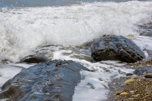 Preview: Pebble Stones On The Sea Beach, The Rolling Waves Of The Sea With Foam