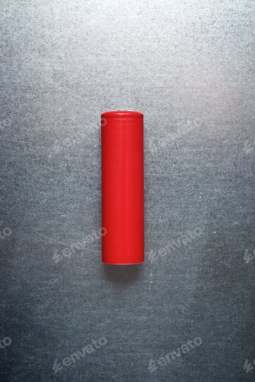Preview: Small Battery On A Metal Table.