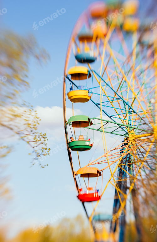 Preview: Blue Sky And Colorful Bows Of An Ancient Ferris Wheel