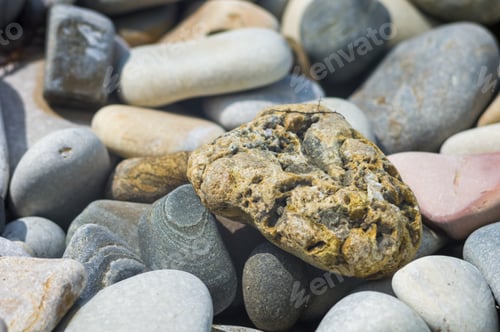 Preview: Boulders And Colorful Pebbles On The Beach