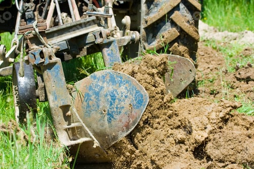 Preview: Red Tractor Plowing In An Orchard