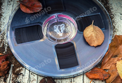Preview: Vintage Reel With A Tape On The Old Dirty Table Outdoor Closeup
