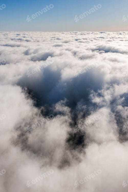 Preview: Aerial View From Airplane Over The Clouds And Sky