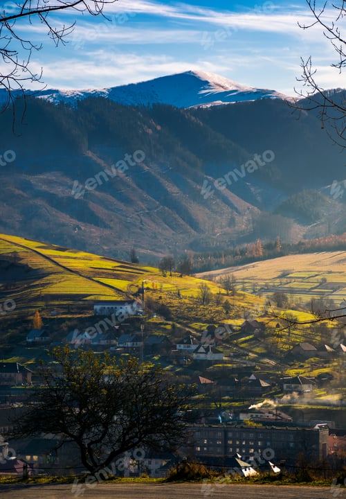 Preview: Lovely Countryside Scenery In Afternoon. Village Down In The Valley. Distant Mountain With Snowy