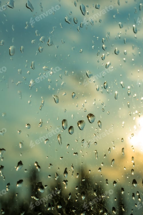 Preview: Raindrops On Window Glass On Background Of Cloudy Sky