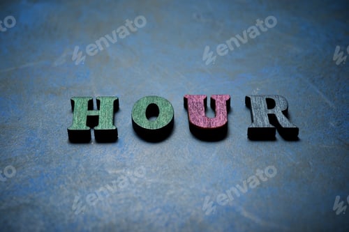 Preview: Hour Word On A Blue Table.