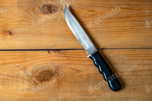 Preview: Knife On The Old Wooden Board Closeup