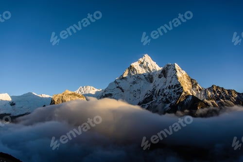 Preview: Snow Capped Mountains with Clouds on Sunny Day