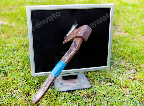 Preview: Axe To Smash A Computer Screen On The Grass Background