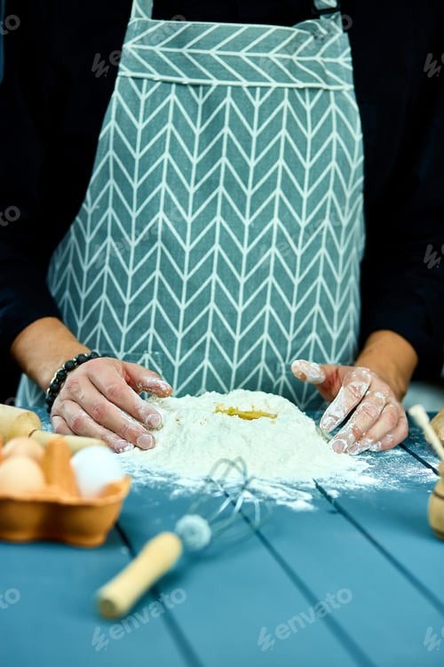 Preview: Man Forming The Dough On A Floured Surface And Kneading It With His Hands At Home. Hand Of Baker