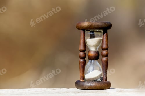 Preview: Abstract Hourglass On Wooden Surface