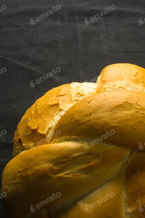 Preview: Fresh Braided Loaf Of White Wheat Bread On Black Background