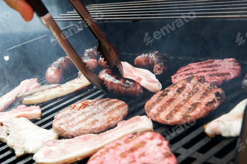 Preview: Preparation Of A Barbecue With Sausages, Burgers And Bacon.
