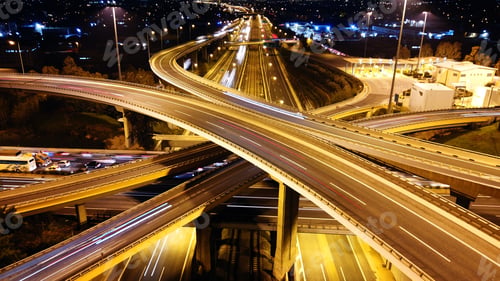 Preview: Aerial Drone Slow Shutter Night Shot Of Urban Elevated Toll Ring Road Junction And Interchange