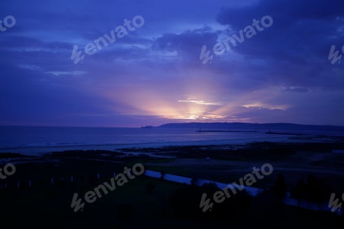 Preview: Beautiful Sunset - Dark Sea, Blue Sky And Clouds With Bright Rays Of Light