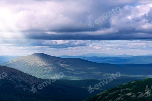 Preview: Landscape Of The Northern Mountains With Beautiful Sunbeams Making Their Way From Behind The Clouds
