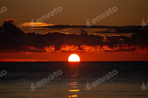 Preview: Colorful Sunset Or Sunrise In The Sea With Bright Colors And Dramatic Clouds And Fisherman Boats