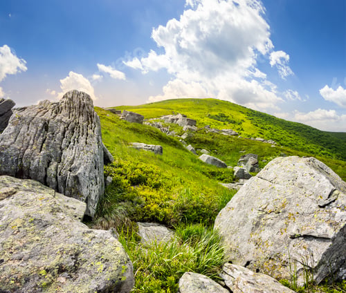 Preview: Mountain Summer Landscape. Meadow With Huge Stones Among The Grass On Top Of The Hillside Near The