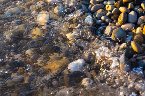 Preview: Sea Pebble Beach With Multicoloured Stones, Transparent Waves With Foam, On A Warm Summer Day