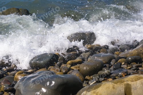 Preview: Rocky Sea Shore With Pebble Beach, Transparent Waves With Foam, On A Warm Summer Day