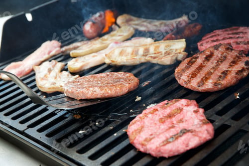Preview: Preparation Of A Barbecue With Sausages, Burgers And Bacon.