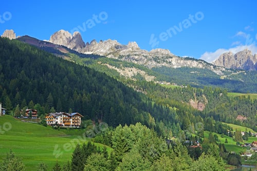 Preview: Looking Along The Valley Towards Alpine Lodges And The Open Countryside With The Distant View Of
