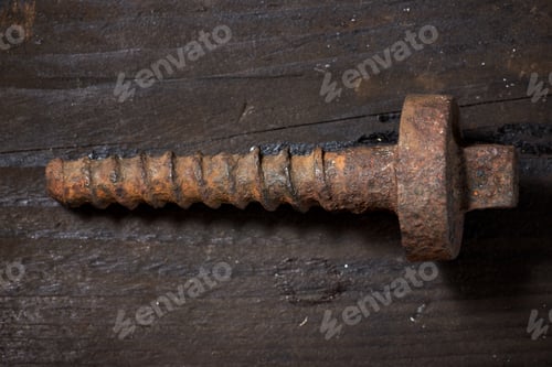 Preview: Railroad Screw On A Wooden Table.