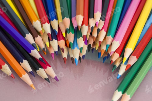 Preview: Group Of Sharp Colored Pencils With White And Red Background And Reflexions