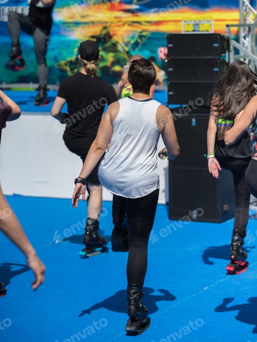 Preview: People In The Gym Doing Fitness Exercises With Special Elastic And Jumping Boots.