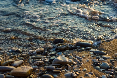 Preview: Pebble Stones On The Sea Beach, The Rolling Waves Of The Sea With Foam