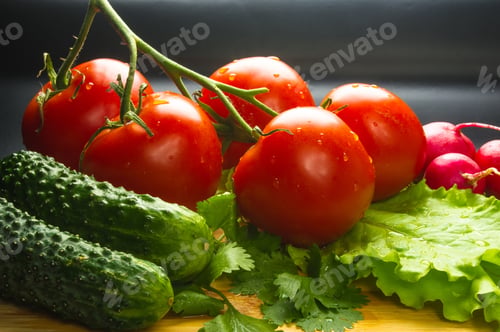 Preview: Still Life - Tomatoes On Twig, Cucumbers, Lettuce And Cilantro On A Wooden Board