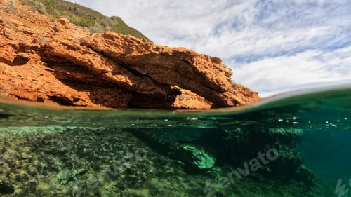 Preview: Split Underwater Photo Of Tropical Exotic Caribbean Emerald Calm Sea Rocky Bay