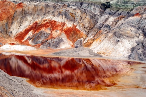 Preview: Clay Desert Canyon With A Lake With Red Water At The Bottom And Colorful Minerals On The Slopes