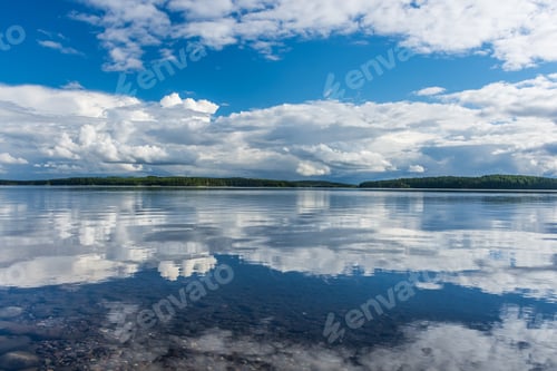 Preview: Perfect And Symmetric Reflection Of Finnish Lake With Clouds And Blue Sky Near Punkaharju, Finland