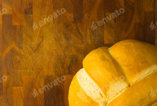 Preview: Fresh Braided Loaf Of White Wheat Bread On Wooden Background