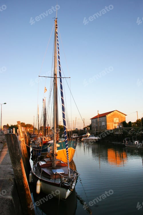 Preview: Sailboats And Yachts Anchored At The Quay And Pier In The Harbor At Suset