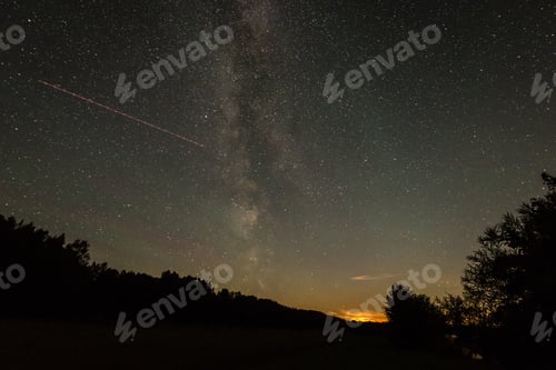 Preview: Beautiful Milky Way Galaxy On A Night Sky And Silhouette Of Tree With Cloud, Long Exposure
