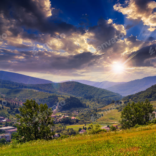 Preview: Summer Landscape. Village At The Foot Of The Mountain. Forest And Valley In Mountain At Sunset