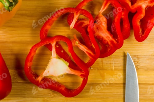 Preview: Sliced Fresh Red Paprika, Bell Pepper On Bamboo Cutting Board