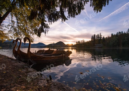 Preview: Swan Boats At Sunrise At Lake Bled. Dark And Vivid Red Sunrise In Slovenia.